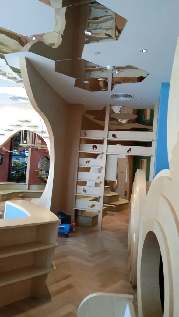 Curved timber fit-out with a staircase at Mitsui Lalaport